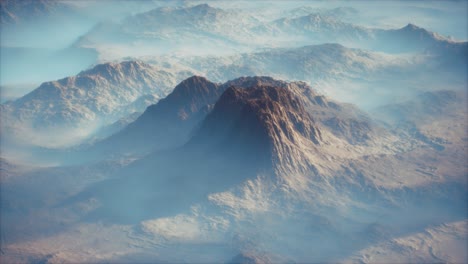 Distant-mountain-range-and-thin-layer-of-fog-on-the-valleys
